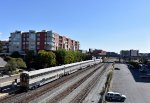 The San Joaquin Train heads away from Emeryville Station toward its next and last stop of Oakland Jack London Square